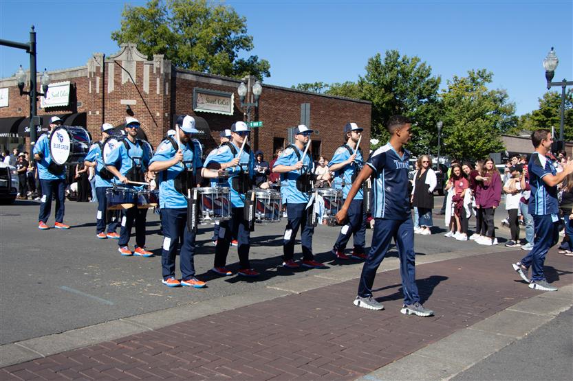 Students walk in the homecoming parade
